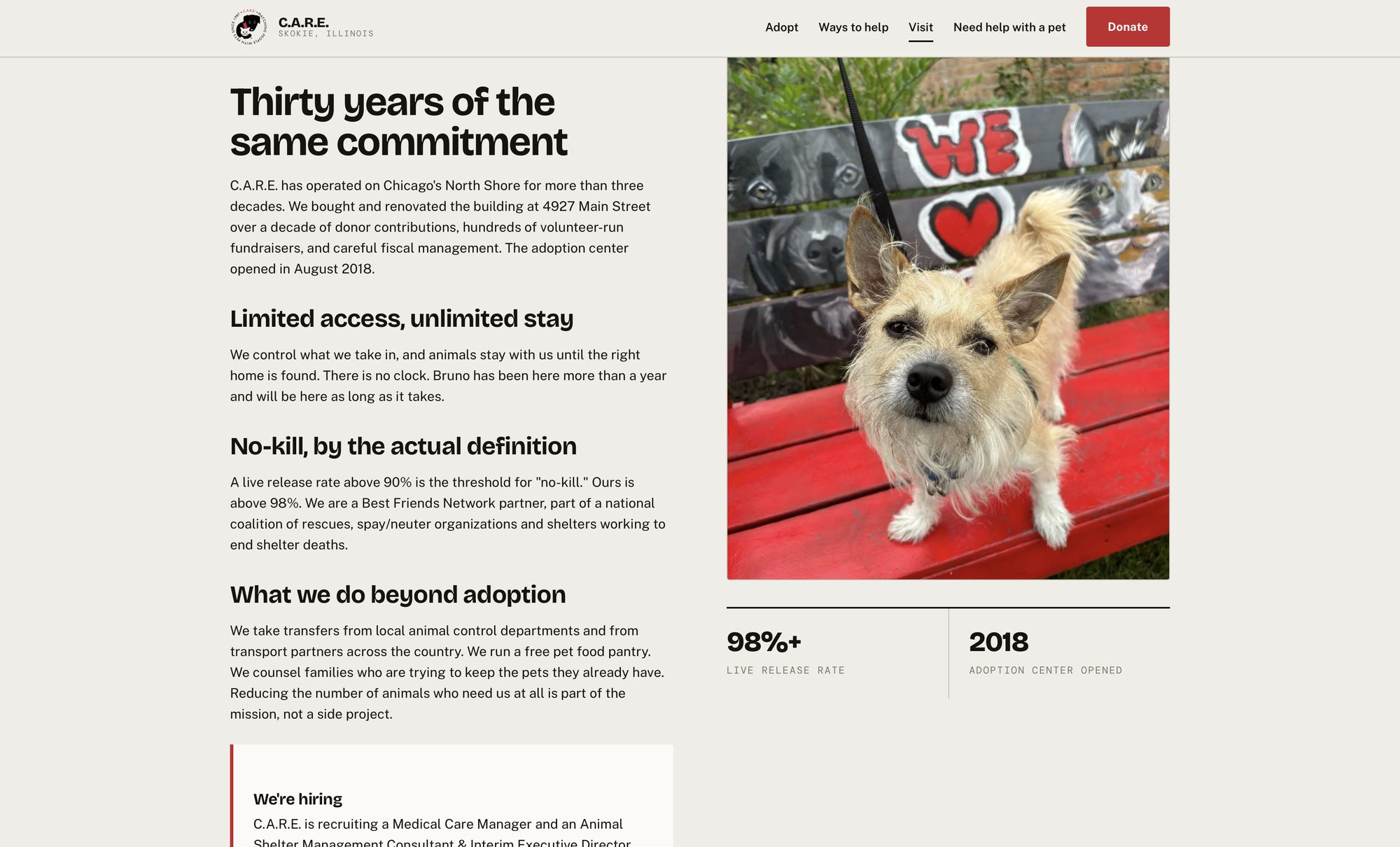 About section headed Thirty years of the same commitment, with subsections on limited access unlimited stay and no-kill by the actual definition, beside a photograph of a terrier on a red bench in front of a painted mural.